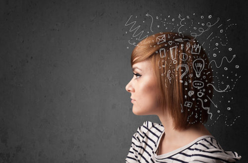 Young girl thinking with abstract icons on her head